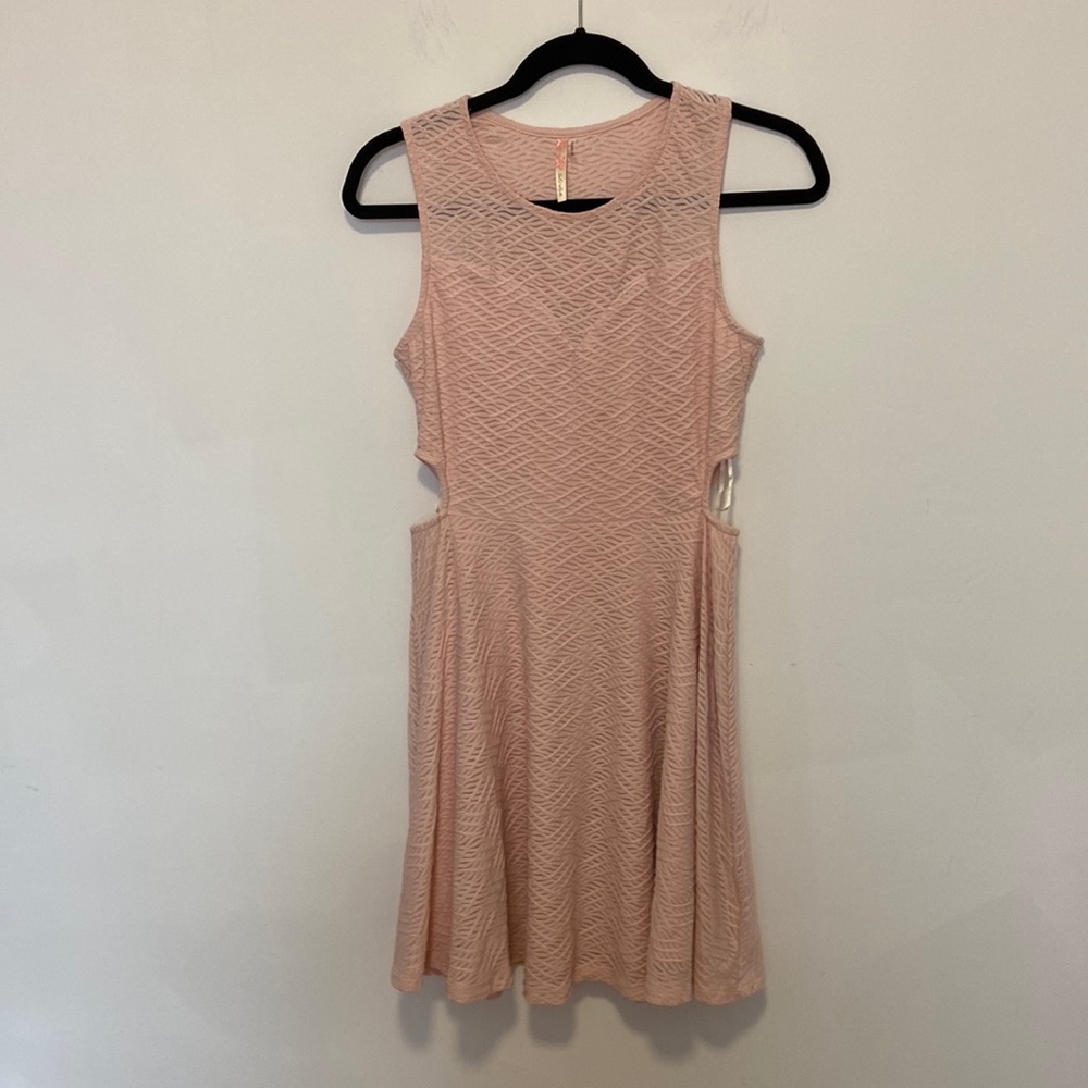 Pink skater style dress with cutouts